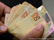 Lote extra de R$ 1,5 bi do abono salarial ser&aacute; pago nesta quarta-feira